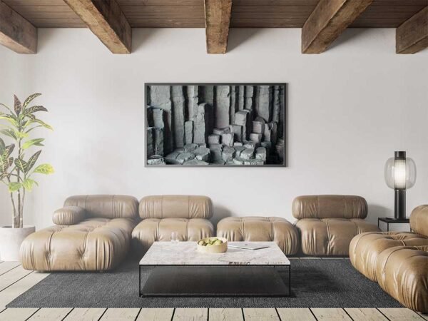 Example of a framed print with the Basalt Columns With Unusual Colouring design hanging on a lounge wall.
