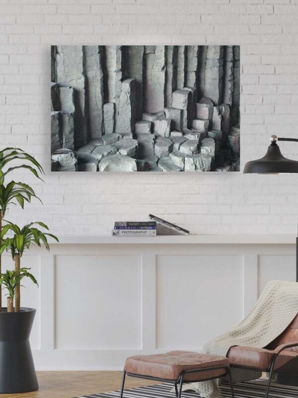 Example of a metal print with the Basalt Columns With Unusual Colouring design hanging on a living area wall