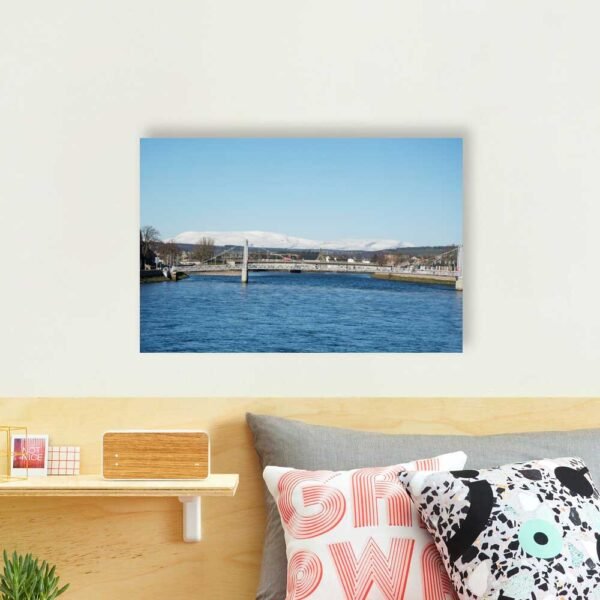 Example of a photographic print with the Ben Wyvis from Ness Bridge design hanging on a bedroom wall