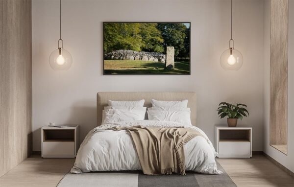Example of a framed print with the Cairn And Standing Stone design hanging on a bedroom wall.