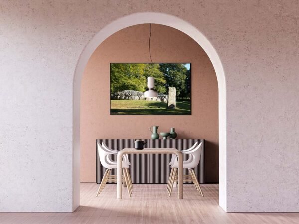 Example of a framed print with the Cairn And Standing Stone design hanging on a dining room wall.