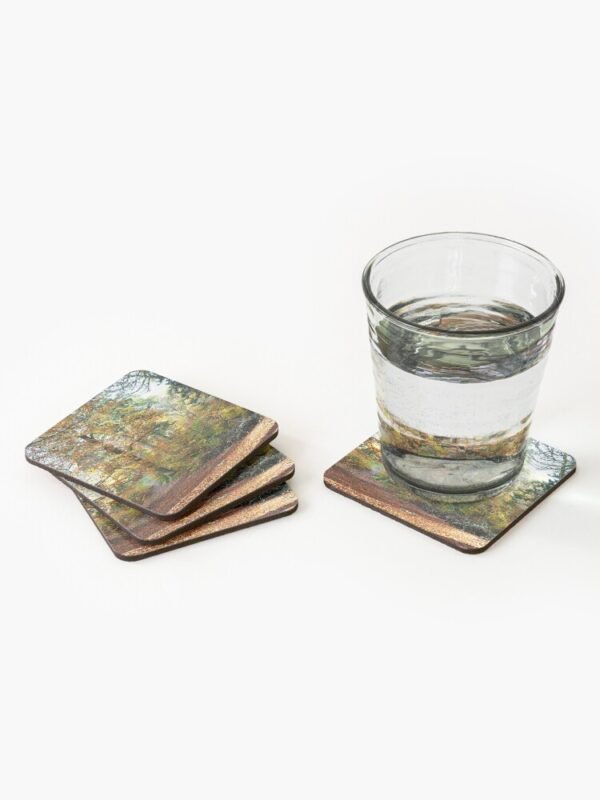 Amongst the Memories set of 4 Coasters - three are sitting in a bundle and one is sitting next to them with a glass containing clear liquid.