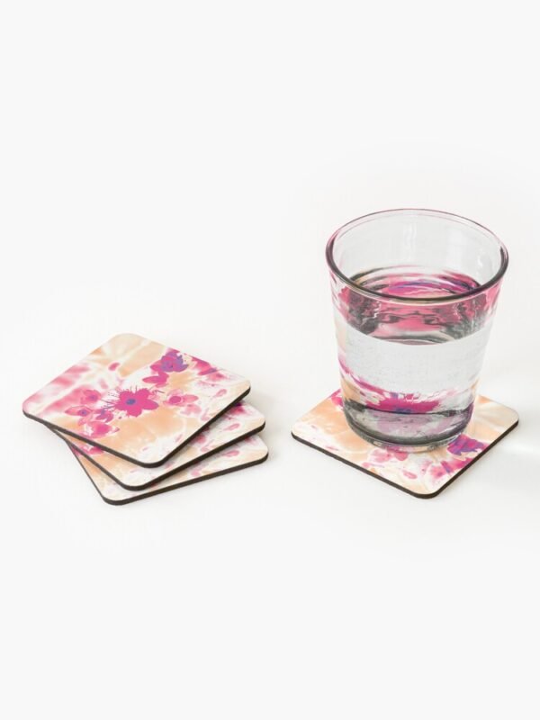 Alternative Hypericum set of 4 coasters - one coaster has a glass of clear liquid, while the other 3 are partially stacked on top of each other.