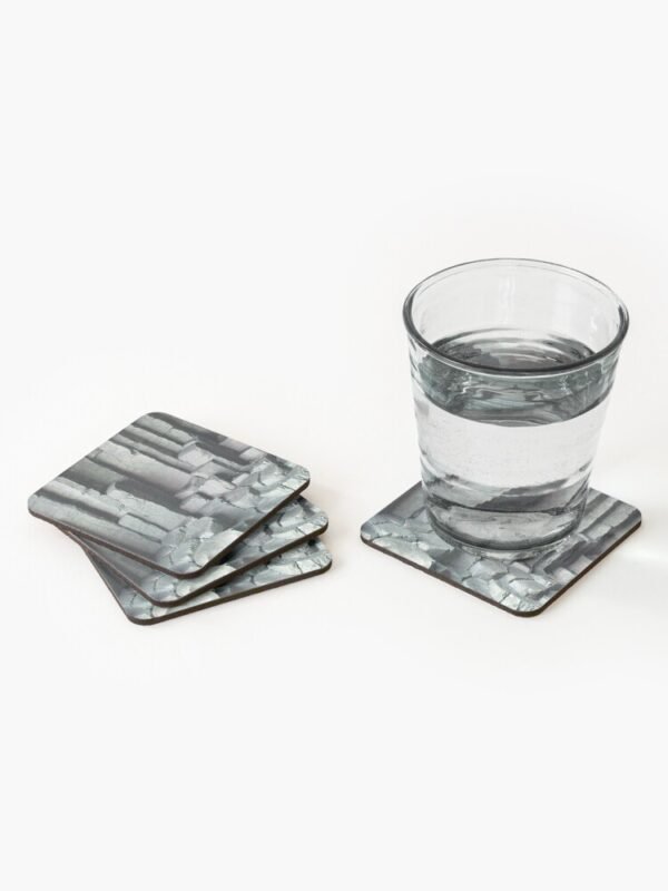 Basalt Columns set of 4 Coasters with a stack of 3 coasters on the left and on the right a coaster with a glass containing clear liquid