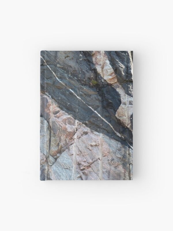 A hardcover journal with a closeup image of a multi-coloured rockface on its cover