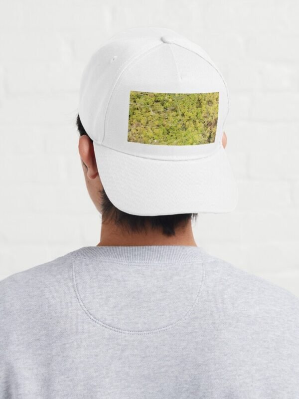 A young male wearing A Bed of Sphagnum Moss Baseball Cap - with the cap back to front