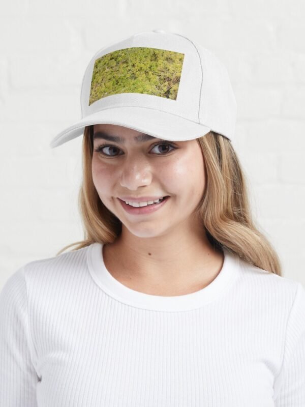 A young female wearing A Bed of Sphagnum Moss Baseball Cap
