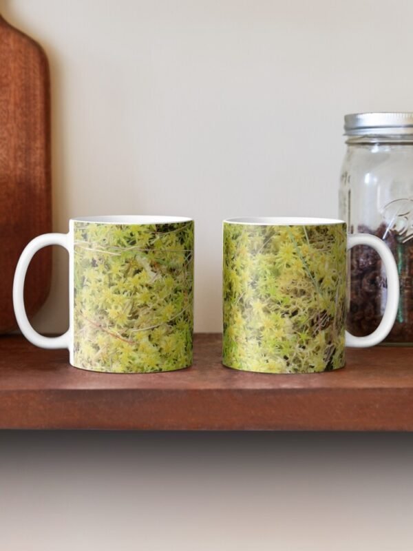 A Bed of Sphagnum Moss classic mug - two mugs sitting on a shelf - one with the handle to the left the other to the right