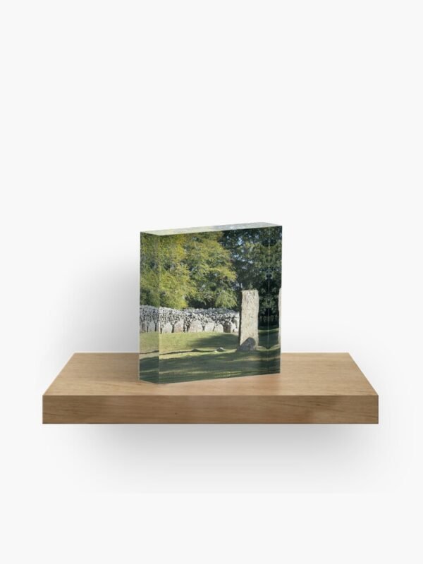 Cairns and Standing Stone Acrylic Block sitting on a shelf