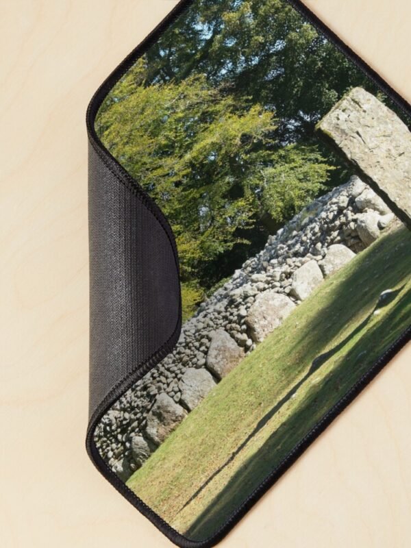 Cairns and Standing Stone Mouse Mat with one corner curled over to show the base