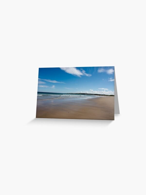 A greeting card with a photograph of an expansive sandy beach at Lossiemouth on its front