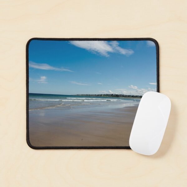 A mouse mat/ pad with a photograph of an expansive sandy beach at Lossiemouth on its front