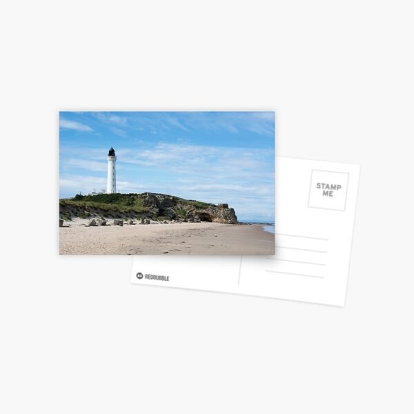 A postcard with the image of a lighthouse on some rocks at a sandy beach