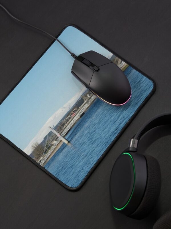 Ben Wyvis Mouse Mat with a black mouse sitting on it next to black headphones