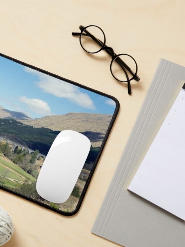 A mouse mat/pad with an image of the Glenfinnan viaduct on its front