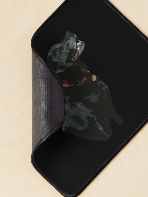 Adoration from a Black Labrador Mouse Mat with the corner curled round to show the underside of the mat