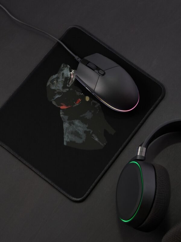 Adoration from a Black Labrador Mouse Mat with a black mouse on the mat and black headphones next to the mat.
