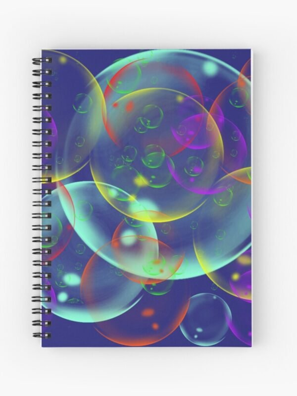 A spiral notebook with an image of different sized, and coloured bubbles on its front cover