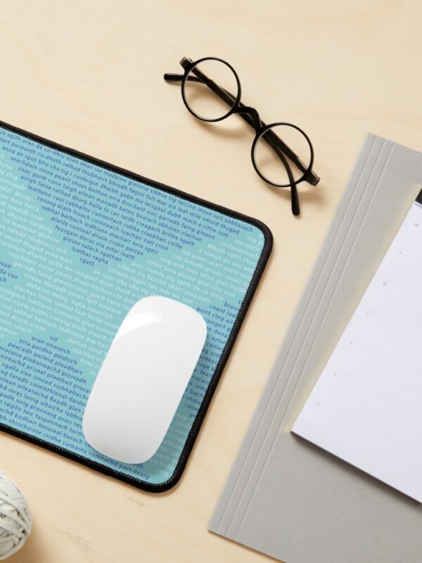 A mouse mat/pad with Gaelic words in the shape of a saltire on its front